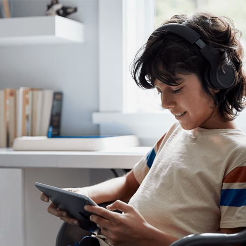 Illustrative context image of a young person using a tablet.